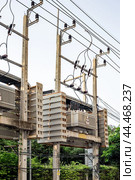 High voltage transformers with wires that convert electricity. Power engineering and construction. Стоковое фото, фотограф Коханова Наталья / Фотобанк Лори