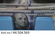 Counting cash in a bustling bank while handling multiple transactions in the city during working hours. Стоковое видео, видеограф Сергей Толмачёв / Фотобанк Лори