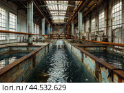 Abandoned industrial facility interior with water trenches. Стоковое AI-изображение, AI-художник Иван Рябоконь / Фотобанк Лори