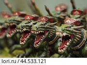 Fantasy lizard warrior figurines in battle formation. Стоковое AI-изображение, AI-художник Иван Рябоконь / Фотобанк Лори