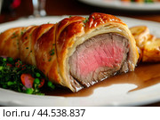 Rich Beef wellington dish. Generate Ai. Стоковое AI-изображение, AI-художник Иван Рябоконь / Фотобанк Лори