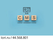 CMS Content Management System banner. CMS Block letters on blue background. Cms written on a wooden cubes. website management software, internet technology concept. Стоковое фото, фотограф Павел Муравьев / Фотобанк Лори