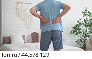 Back pain, kidney stones, inflammation and disease, man suffering from backache at home, health problems concept. Стоковое видео, видеограф Станислав Тарко / Фотобанк Лори
