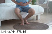 Stomach ulcer, bloating, man with abdominal pain suffering at home, symptoms of gastritis, diseases of the digestive system, health problems concept. Стоковое видео, видеограф Станислав Тарко / Фотобанк Лори