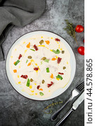 yogurt with additions of syrup, dried fruits and pieces of nuts, top view. Стоковое фото, фотограф Abakumova Ekaterina / Фотобанк Лори