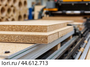 Closeup of particleboard sheets in workshop. Стоковое AI-изображение, AI-художник Иван Рябоконь / Фотобанк Лори