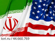 Flag of Iran together with flag of the United States of America. Стоковое фото, фотограф Сергей Толмачёв / Фотобанк Лори