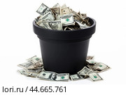 Wasteful wealth: trashcan overflowing with money. Стоковое AI-изображение, AI-художник Иван Рябоконь / Фотобанк Лори