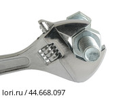 Разводной гаечный ключ на белом фоне. An adjustable wrench on a white background. Стоковое фото, фотограф Татьяна Д / Фотобанк Лори