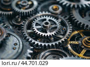 Close up view of complex interlocking industrial gears working together. Стоковое AI-изображение, AI-художник Иван Рябоконь / Фотобанк Лори