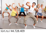 Group of active women practicing energetic dance in a studio. Стоковое фото, фотограф Яков Филимонов / Фотобанк Лори