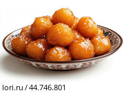 Delicious Tatar chak-chak served on a plate isolated on a white background. Стоковое AI-изображение, AI-художник Veniamin Kraskov / Фотобанк Лори
