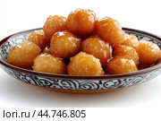 Delicious Tatar chak-chak served on a plate isolated on a white background. Стоковое AI-изображение, AI-художник Veniamin Kraskov / Фотобанк Лори