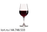 Red wine in elegant glass centered on white background, moderate pour, clear stemware for dining and celebration imagery. Стоковое фото, фотограф Павел Муравьев / Фотобанк Лори