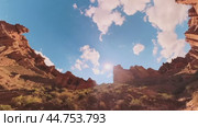Panorama of the picturesque cliffs of the canyon and the blue sky while driving a car. g with a 360 degree panoramic camera. Kazakhstan. Charyn Canyon. 08/31/2024. Стоковое видео, видеограф Ярославский Максим / Фотобанк Лори