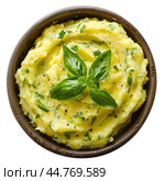 Bowl of mashed potatoes with basil and spices on white background. Стоковое AI-изображение, AI-художник Иван Рябоконь / Фотобанк Лори