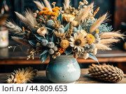 A beautiful bouquet of dried flowers in a ceramic vase on an antique wooden chest of drawers. A bouquet of flowers in a vase in a home interior. Light, beige, blue floral background. Стоковое AI-изображение, AI-художник Photojuli / Фотобанк Лори