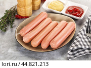 Boiled sausages with ketchup and mustard. Стоковое фото, фотограф Андрей Старостин / Фотобанк Лори