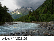 View of the Psysh River and the Amanauz-Bashi Mountain of the Northern Caucasus Mountains near the village of Arkhyz on a sunny summer day, Karachay-Cherkessia, Russia. Стоковое фото, фотограф Ula Ulachka / Фотобанк Лори