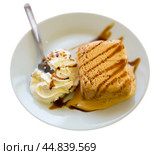 Delicious dessert - ice cream with chewy pieces of Spanish turron closeup. Стоковое фото, фотограф Яков Филимонов / Фотобанк Лори