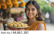 Beautiful indian woman holding plate of sweets smiling during diwali festival. Стоковое AI-видео, аниматор Юрий Поздников / Фотобанк Лори