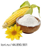 Corncob lying near wooden bowl full of flour and yellow flower. Стоковое AI-изображение, AI-художник Иван Рябоконь / Фотобанк Лори