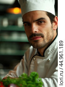 An attractive male chef, showcasing his culinary mastery and charisma. Редакционное AI-изображение, AI-художник Veniamin Kraskov / Фотобанк Лори
