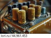 Vintage radio showing electrolytic capacitors on circuit board. Стоковое AI-изображение, AI-художник Иван Рябоконь / Фотобанк Лори