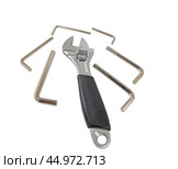 Разводной гаечный ключ на белом фоне. An adjustable wrench on a white background. Стоковое фото, фотограф Татьяна Д / Фотобанк Лори