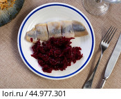 Nicely served sliced salted herring with beet salad on side. Стоковое фото, фотограф Яков Филимонов / Фотобанк Лори