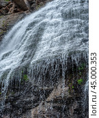 Mountain waterwall. Mountain landscape with waterfall. natural background, trekking, mountain walks, healthy and active lifestyle. vertical image. Стоковое фото, фотограф Павел Муравьев / Фотобанк Лори