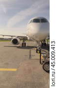 IRKUTSK, RUSSIA - September 13, 2024: Vertical video of preparation for the flight of a modern Russian aircraft Sukhoi Superjet 100 of IrAero airline and moving a mobile boarding ramp for passengers. Редакционное видео, видеограф Виктория Катьянова / Фотобанк Лори