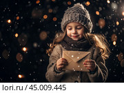 A little girl in winter clothes holding an envelope outside in snowy weather against the background of lights. A letter for Santa Claus. The winter atmosphere of a festive invitation. Стоковое AI-изображение, AI-художник Photojuli / Фотобанк Лори