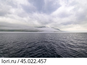 Туман над озером Байкалом. Исток Ангары. Мыс Устьянский (2024 год). Стоковое фото, фотограф Александр Тараканов / Фотобанк Лори