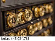 Golden bitcoin cryptocurrency being mined on a computer motherboard. Стоковое AI-изображение, AI-художник Иван Рябоконь / Фотобанк Лори