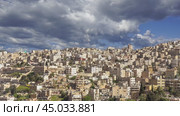 View of the modern houses Amman, Jordan, Middle East. Against the background of a beautiful sky with clouds. Стоковое видео, видеограф Владимир Журавлев / Фотобанк Лори