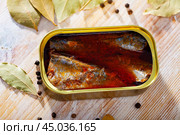 Open tin can of spicy sardines in aluminium can. Стоковое фото, фотограф Яков Филимонов / Фотобанк Лори