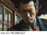 Portrayal of a tattooed man with intense gaze. Стоковое AI-изображение, AI-художник Иван Рябоконь / Фотобанк Лори