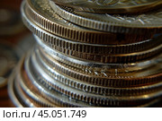 Stack of coins representing growing savings and investment. Стоковое AI-изображение, AI-художник Иван Рябоконь / Фотобанк Лори
