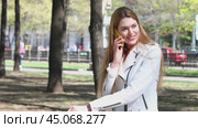 Calling by Phone. Happy beautiful blonde model talking on cell phone. Стоковое видео, видеограф Андрей Аркуша / Фотобанк Лори