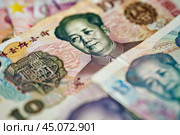 Mao zedong looking sternly from chinese renminbi banknotes. Стоковое AI-изображение, AI-художник Иван Рябоконь / Фотобанк Лори