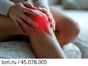 Knee pain, joint inflammation, arthritis and degenerative changes, woman suffering from leg ache and doing self-massage. Стоковое AI-изображение, AI-художник Станислав Тарко / Фотобанк Лори