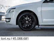 KRASNOYARSK, RUSSIA - August 3, 2024: White Skoda Octavia III A7. Редакционное фото, фотограф Плотников Дмитрий / Фотобанк Лори