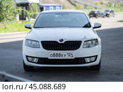 KRASNOYARSK, RUSSIA - August 3, 2024: White Skoda Octavia III A7. Редакционное фото, фотограф Плотников Дмитрий / Фотобанк Лори