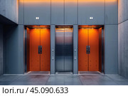 Three elevators with orange doors are waiting in modern building lobby. Стоковое AI-изображение, AI-художник Иван Рябоконь / Фотобанк Лори