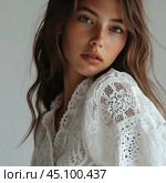 A young girl with natural beauty, dressed in a white lace blouse. Her hair falls freely, and her gaze is directed straight at the camera. Her skin is light with a slight blush, which emphasizes the naturalness and tenderness of the image. The lace elements of the clothing create a feeling of lightness and romance. The background of the photo is neutral, which focuses attention on the model. Стоковое AI-изображение, AI-художник Анна Кривицкая / Фотобанк Лори