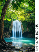 Erawan waterfall cascading through lush green jungle in thailand. Стоковое AI-изображение, AI-художник Юрий Поздников / Фотобанк Лори