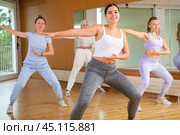 Group are practising arch movement in step jazz dance in fitness gym. Стоковое фото, фотограф Яков Филимонов / Фотобанк Лори