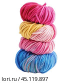 Four skeins of colorful yarn forming a tower on white background. Стоковое AI-изображение, AI-художник Иван Рябоконь / Фотобанк Лори
