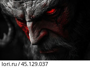 A close-up of the face of a sinister creature with demonic features. It has bright red eyes, dark and wrinkled skin with a rough texture, and a long gray beard. The face is illuminated by a red light, which gives the image a frightening and aggressive look. The combination of shadow and light creates a strong contrast, emphasizing the details and the harshness of the expression. Стоковое AI-изображение, AI-художник Анна Кривицкая / Фотобанк Лори